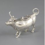 A 1960's German sterling silver cow creamer, the hinged cover embossed with a fly, import marks