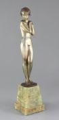 A Lorenzl Art Deco silvered bronze figure of a standing nude girl, signed in the bronze, on green