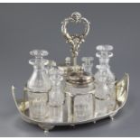 A George III silver boat shaped cruet stand, with reeded, borders, engraved armorial and mask ring