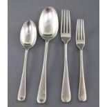 An Edwardian part canteen of silver Hanovarian rat tail flatware by Elkington & Co, comprising