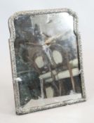 A large antique Dutch repousse silver mounted easel mirror, of shaped rectangular form, with pierced