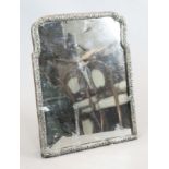 A large antique Dutch repousse silver mounted easel mirror, of shaped rectangular form, with pierced