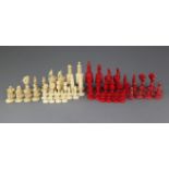 A 19th century Anglo Indian carved and stained bone chess set, kings 4.5in., and another similar