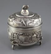 A late 19th century Indian silver circular box and cover by C. Krishniah Chetty, Bangalore, embossed