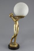 An Art Deco bronzed spelter table lamp, modelled as a maiden holding a globe, 20in.