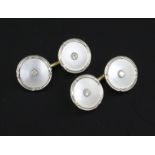 A pair of mid 20th century 14ct gold, mother of pearl and diamond set circular cufflinks.