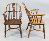 A set of three 19th century yew wood and elm Windsor chairs, with crinoline stretchers, and