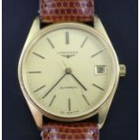 A gentleman's 18ct gold Longines automatic wrist watch, with baton numerals and date aperture, on