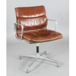 A Ray and Charles Eames EA208 'soft pad' aluminium and brown leather swivel armchair, W.1ft 1in. H.