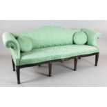 A late 19th century Adam style mahogany camel back settee, upholstered in green foliate fabric, on