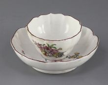 A Chelsea petal lobed tea bowl and saucer, c.1755, each painted with insects and floral sprays,