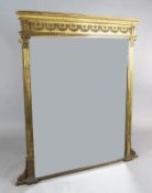 A late Victorian giltwood and gesso overmantel, with floral swag frieze and bevelled plate, W.4ft