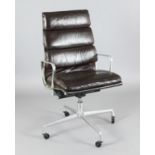 A Charles and Ray Eames EA216 'soft pad' high back swivel armchair, aluminium frame covered with