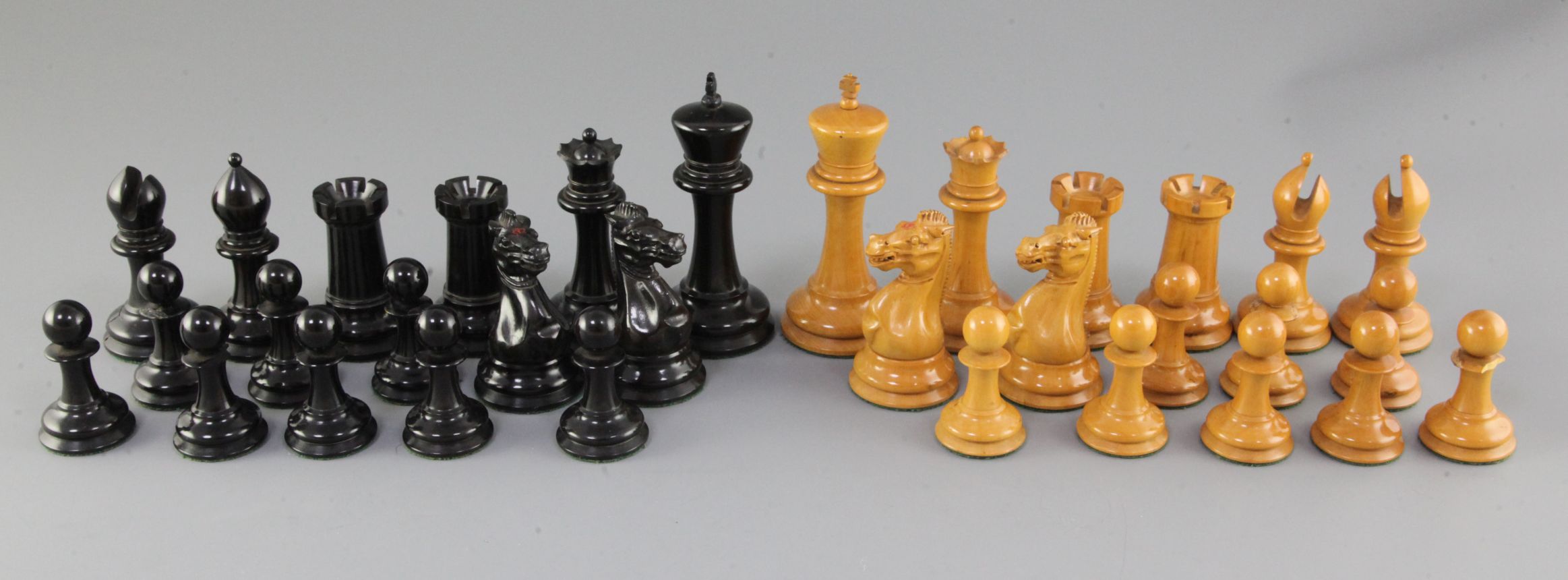 A Jaques Staunton pattern ebony and boxwood club chess set, weighted, with original case but no