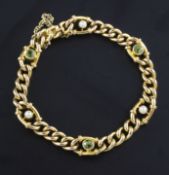 An Edwardian 15ct gold, peridot & seed pearl set curb link bracelet, 6.5in