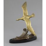 A. Leger. An Art Deco bronze model of a seagull flying over waves, signed in the bronze, on black