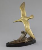 A. Leger. An Art Deco bronze model of a seagull flying over waves, signed in the bronze, on black