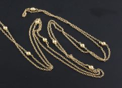 An Edwardian 15ct gold guard chain, with spherical spacers, 58in.