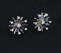 A pair of white gold, sapphire and diamond set starburst ear studs, lacking butterflies, 0.75in.