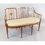 An Edwardian Period Sheraton Revival triple back inlaid satinwood settee, the triple back has vase