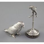 An Edwardian silver mounted combination pin cushion/ring tree modelled as a parrot on a perch,
