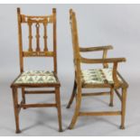 A set of eight Arts & Crafts oak dining chairs, including two carvers, with squared legs, the padded