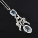 A platinum, aquamarine and diamond set double drop pendant, the aquamarines with a total weight of