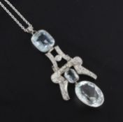A platinum, aquamarine and diamond set double drop pendant, the aquamarines with a total weight of