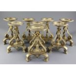 A set of eight Victorian gilt metal comport stands by Cartwright & Woodward, of tripod form, with