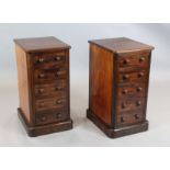 A pair of Victorian mahogany pillar chests, fitted five drawers, W.1ft 4in. D.1ft 6in. H.2ft 6in.