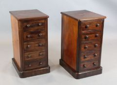 A pair of Victorian mahogany pillar chests, fitted five drawers, W.1ft 4in. D.1ft 6in. H.2ft 6in.