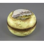 A Meissen yellow ground trinket box and cover, 19th century, painted with a titled view of