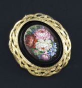 An early 20th century French 18ct gold mounted micro mosaic brooch, with floral decoration, 1.5in.