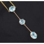 A gold and triple zircon drop bar pendant necklace, pendant 2.5in.