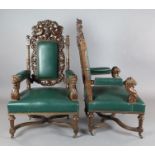A pair of late Victorian carved oak armchairs, decorated with dragons and lions heads, upholstered