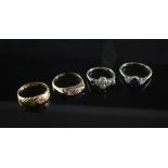 Four early 20th century 18ct gold and gem set rings, to include two ruby and diamond, a sapphire and