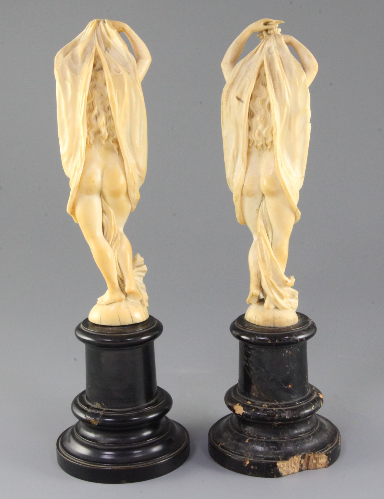 A pair of 19th century Dieppe ivory carvings of muses, standing semi-clad with arms aloft, on - Image 2 of 2