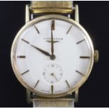A gentleman's 1950's 14ct gold Longines manual wind wrist watch, with baton numerals, subsidiary