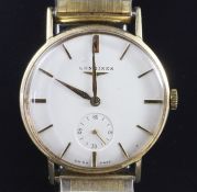 A gentleman's 1950's 14ct gold Longines manual wind wrist watch, with baton numerals, subsidiary