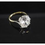 A gold, platinum and solitaire diamond ring, the old European cut stone weighing in excess of 4.