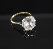 A gold, platinum and solitaire diamond ring, the old European cut stone weighing in excess of 4.