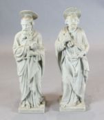 A pair of late 19th / early 20th century carved marble figures of St Peter and a Saint Paul