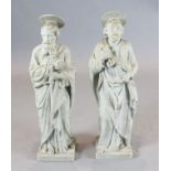 A pair of late 19th / early 20th century carved marble figures of St Peter and a Saint Paul