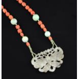 An early 20th century coral, jade and nephrite pendant necklace, the pendant, pierced and carved