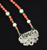 An early 20th century coral, jade and nephrite pendant necklace, the pendant, pierced and carved