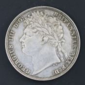 A George IV silver half crown 1821, knock to edge at 11 o'clock otherwise EF, toned
