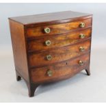 A Regency mahogany bowfront chest, of four graduated long drawers, fitted brass handles, on swept