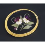 A late 19th/early 20th century Italian gold mounted pietra dura and paste oval brooch, with floral