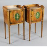 A pair of Edwardian Sheraton Revival painted satinwood bedside cabinets, with tambour fronts, on