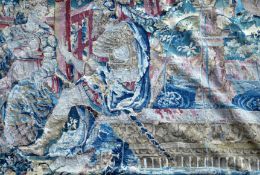 A 17th century tapestry fragment, depicting figures with a fountain beyond, W.3ft 4in. H.4ft 9in.